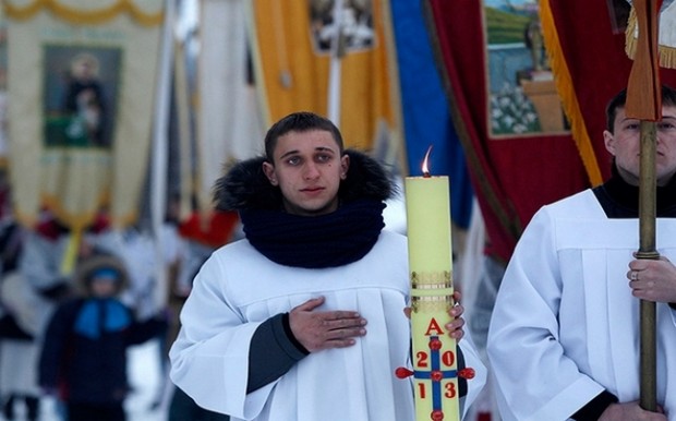 Belarusian Roman Catholics take part in a procession