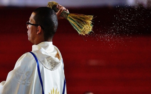 A priest blesses the congregation at Regina Mundi church in Soweto