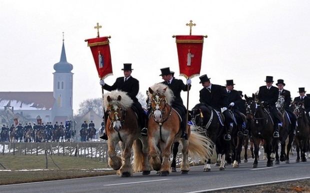 Men of the Sorbian community ride on decorated horses