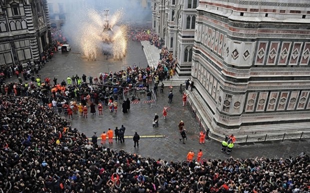 People watch the traditional Explosion of the Cart